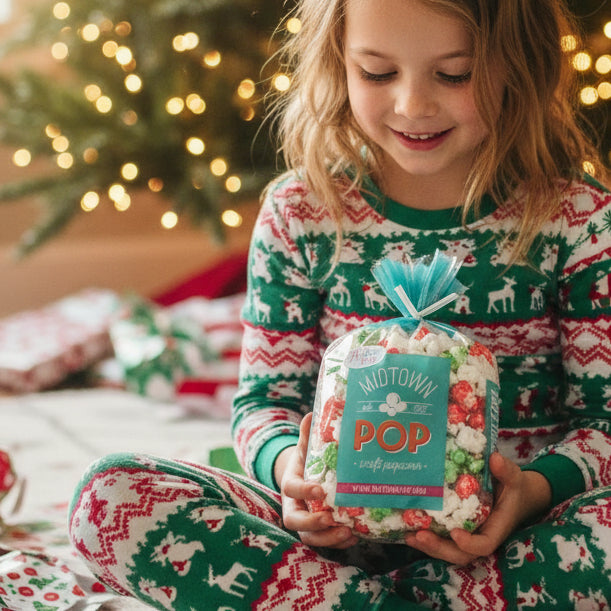 red and green candy coated popcorn midtown mix and white salted popcorn, 'Midtown Pop' brand label.